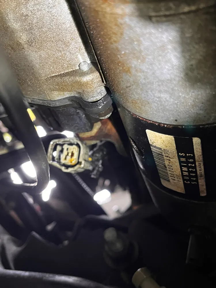 Close up of a diesel starter and its wiring connector